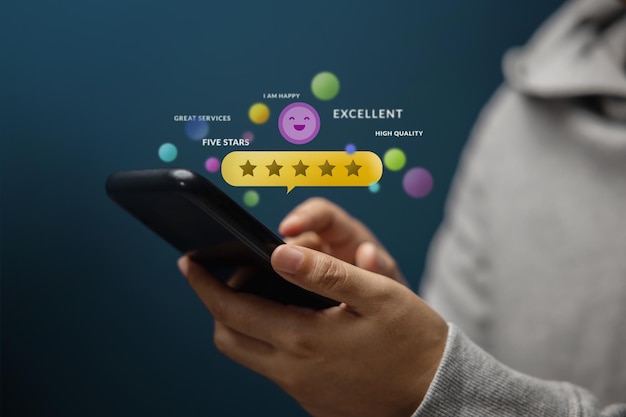 Customer Experiences Concept Happy Client Using Smartphone to Review Five Star Rating for Online Satisfaction Surveys Positive Feedback on Mobile Phone