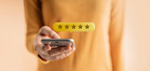 Customer Experiences Concept Happy Client Using Smartphone to Submit Five Star Review Rating for Online Satisfaction Surveys Positive Feedback on Mobile Phone