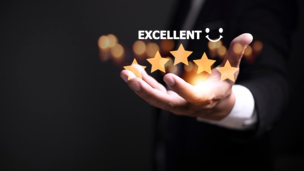 Customer hand with gold five star rating feedback icon and press level excellent rank for giving best score point to review the service business concept