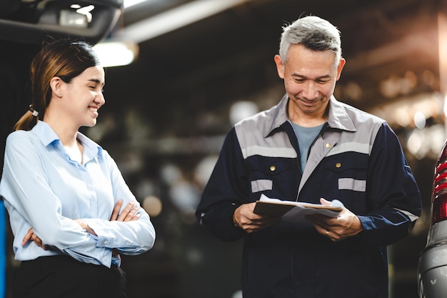 Customer making inspection check to a car engine repair occupation job at garage service mechanic technician person workshop to vehicle auto maintenance transportation term of automobile industry