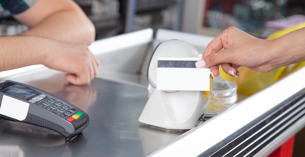 Customer making payment using credit card in a supermarket