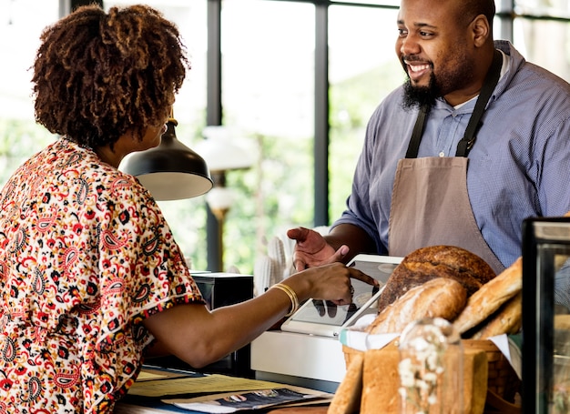 Customer ordering pastry at counter