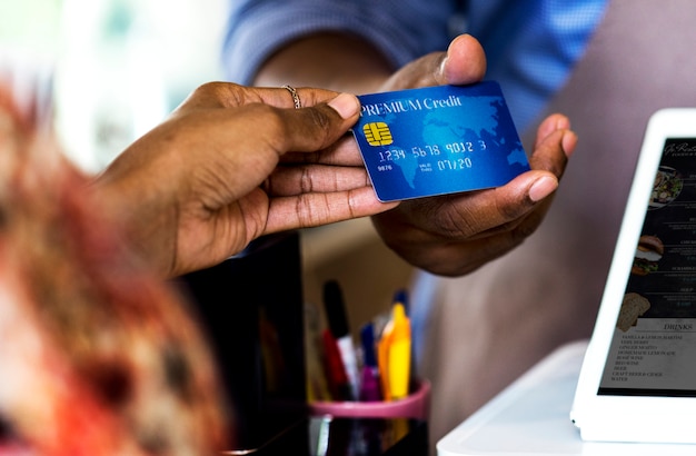 Customer paying for bakery products by credit card