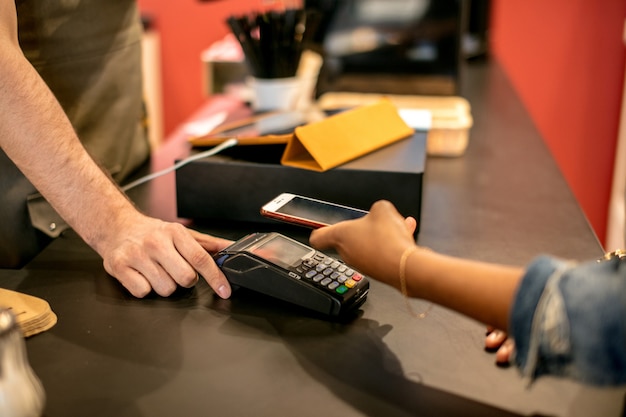 Customer paying with a smartphone