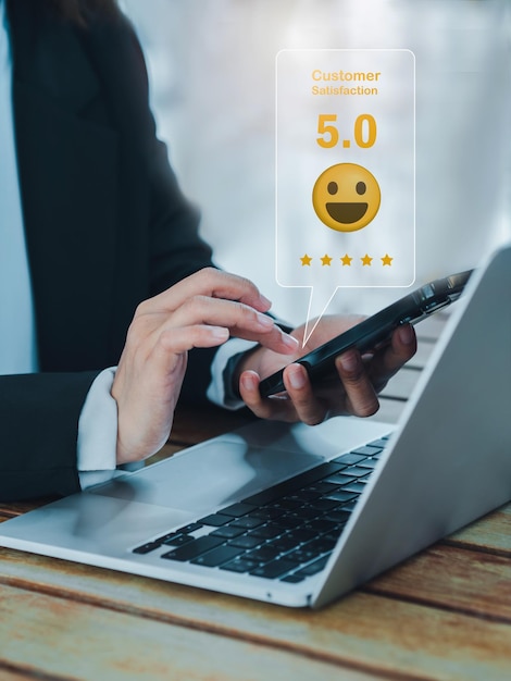 Customer review satisfaction feedback survey concepts The User giving 5 stars rating with smile face icon to service experience business ranking on online application by smart mobile phone