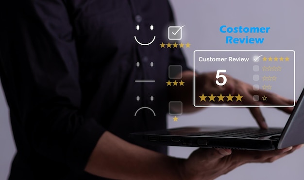 Customer Review Young Man hand uses laptop to review and give 5 stars with very good results