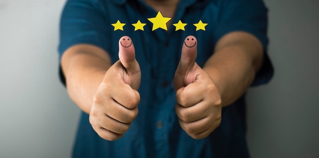 Customer satisfaction concept thumbs up smiley face icon rating 5 stars positive concept positive