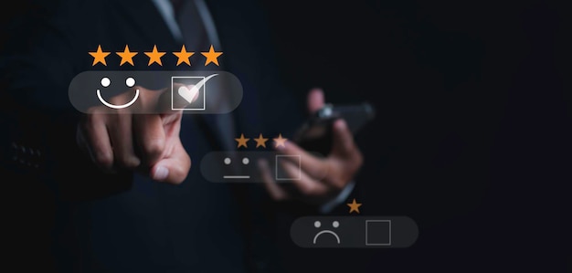 Customer satisfaction experience concept Businessman choosing happy smiley face icon to give satisfaction in service rating very impressed copy space