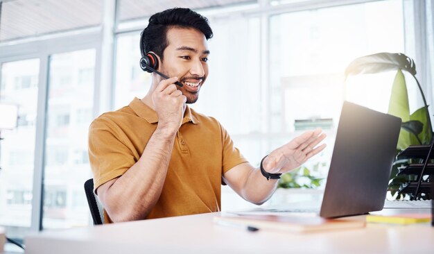 Customer service laptop and happy business man talking on contact us telemarketing or online telecom Communication consultant tech or Asian person in call center consulting for technical support