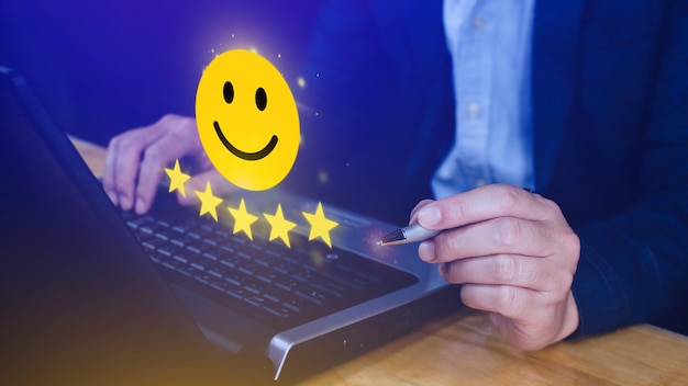 Customer services best excellent business rating experience Positive Review and Feedback Satisfaction survey concept Hand of a businessman show happy smile face with five star