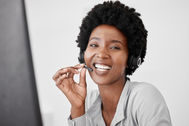 Customer support call center and telemarketing with a woman consultant using a headset for communication in her office Sales crm and contact us with a female consulting on call for help and advice