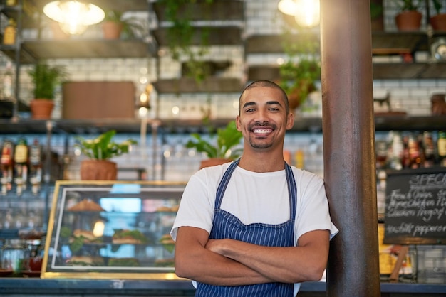 Customers always stop by for some quality service Portrait of a young entrepreneur standing in his business