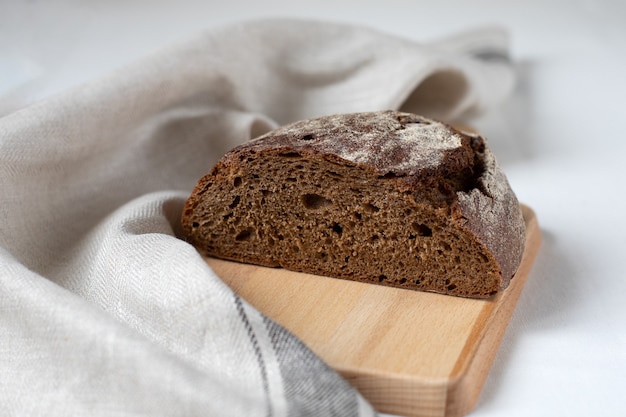 Cut black rye bread on a wooden board