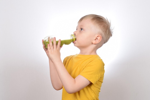 cut boy drinking fresh fruit juice