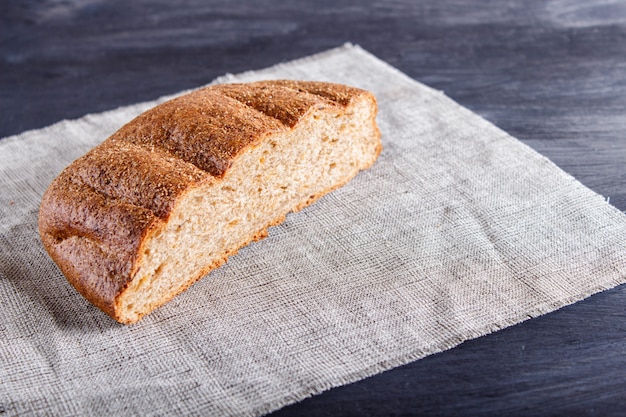 Cut buckwheat bread on linen napkin.