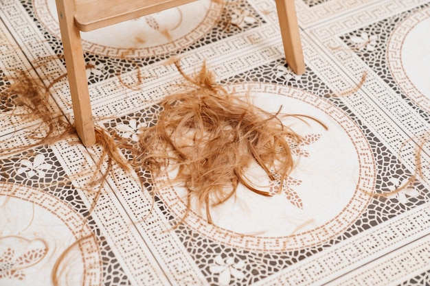 Cut hair falls to the floor waste from cutting hair