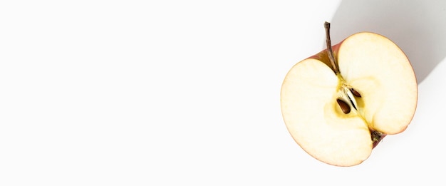 Cut half of an apple on a white background Top view flat lay Banner