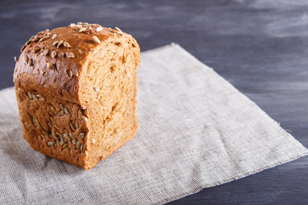 Cut rye bread on linen napkin.