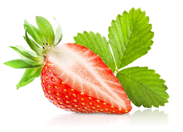 Cut strawberry and leaf on white isolated background