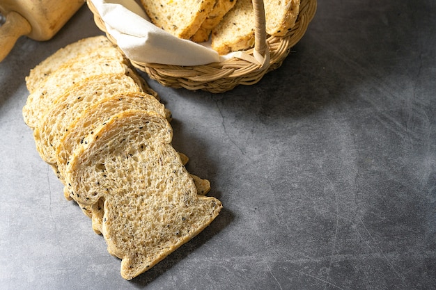 Cut with slices and whole grain bread Homemade fresh bread on the floor