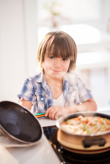 Cute adorable little boy in the kitchen