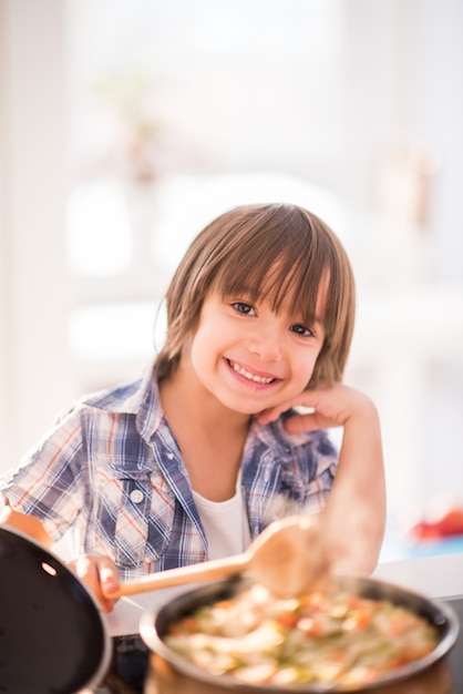 Cute adorable little boy in the kitchen