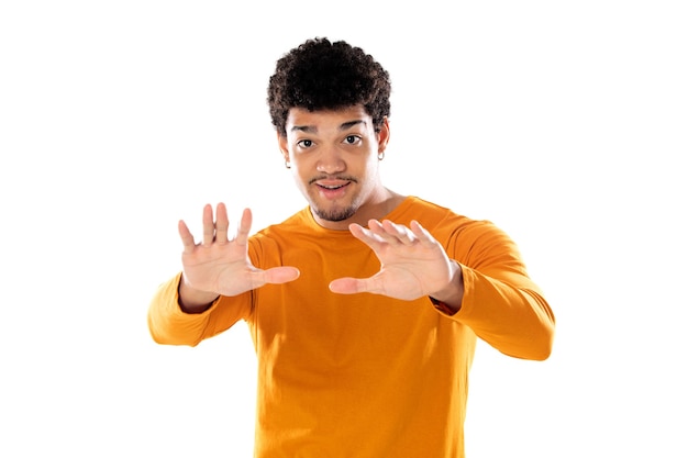 Cute african american man with afro hairstyle wearing a orange T-shirt isolated