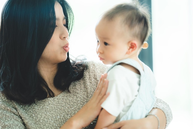 Cute asian baby child person portrait little childhood in happy and innocence concept small adorable kid support by mother care