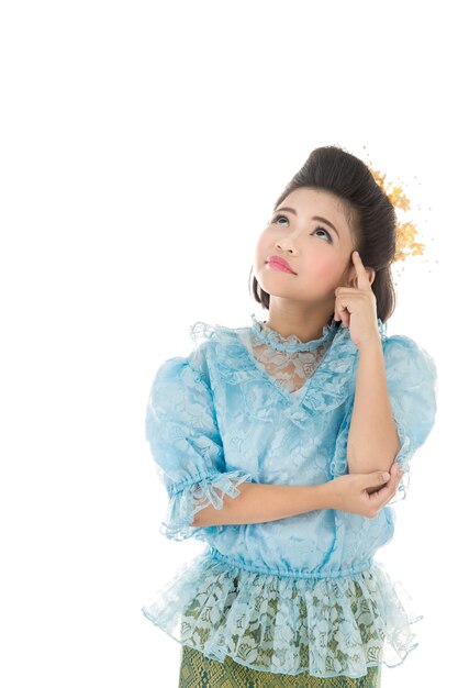 Cute asian girl in Thai costume on white background. 