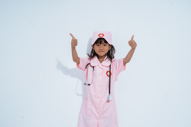 Cute asian little girl wearing a doctor uniform