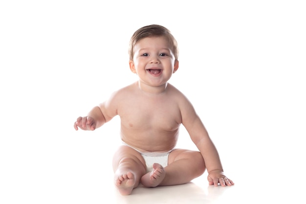 Cute baby in diaper looking at the camera isolated on a white background