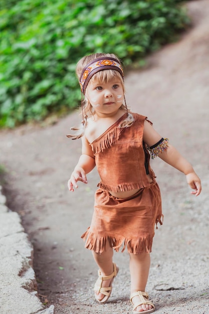 Cute baby dressed in traditional Native American costume