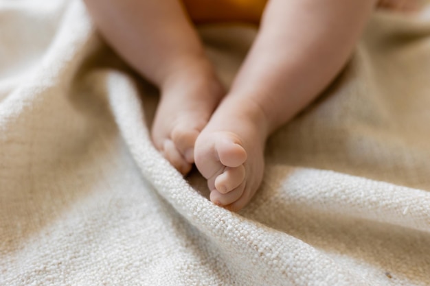 cute baby feet on blanket, card, banner, space for text, health