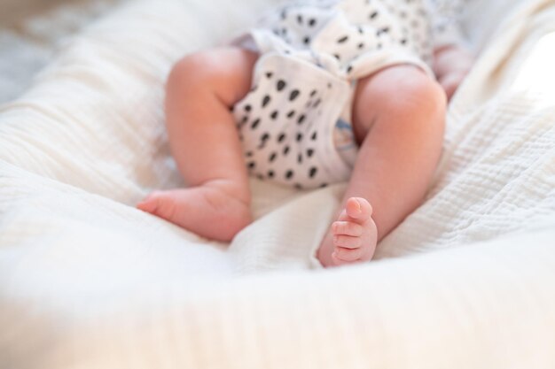 Cute baby feet on the blanket