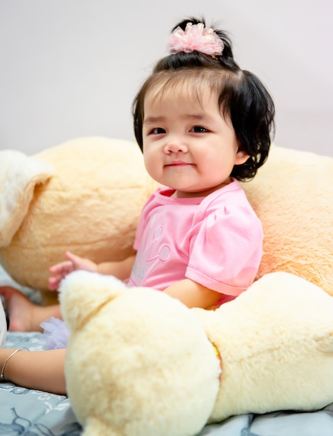 Cute baby girl in a pink dress