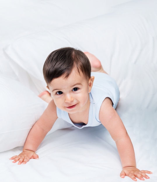 Cute baby laying on the bed