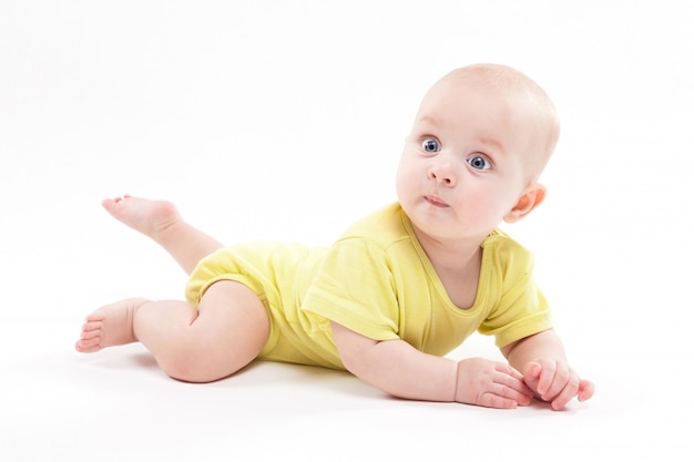 Cute baby lying on the  and smiling