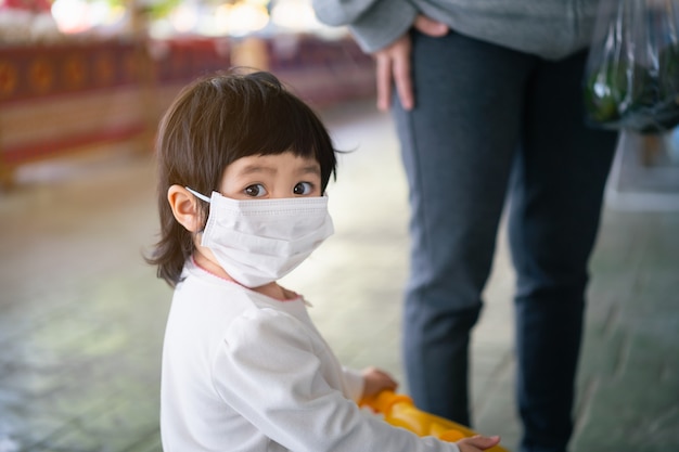 Cute baby wearing surgical mask, Covid-19 Coronavirus Protection Concept