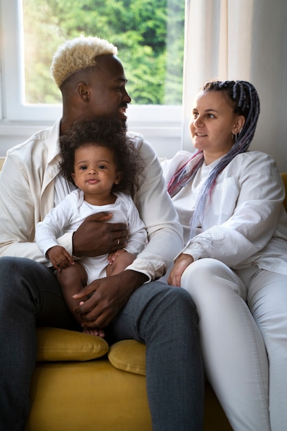 Cute black baby at home with parents