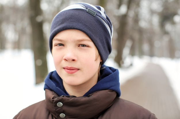 Cute boy in park on winter vacation