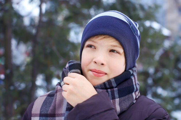 Cute boy in park on winter vacation