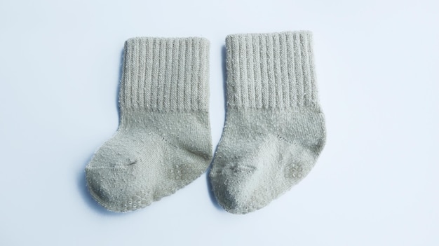 Cute brown baby sock isolated on white background