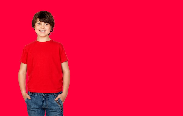 Cute brunette boy in red t shirt