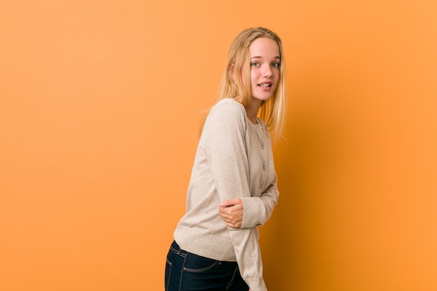 Cute caucasian teenager posing standing