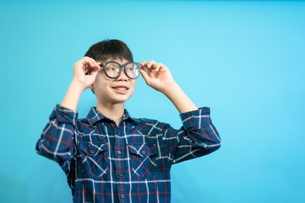 cute and cheerful people, wearing glasses looking and smile  on blue pastel background