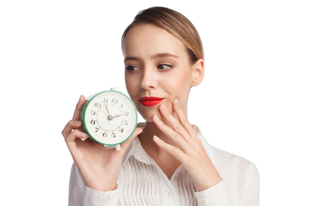 Cute cheerful woman with alarm clock isolated on white background, time management concept