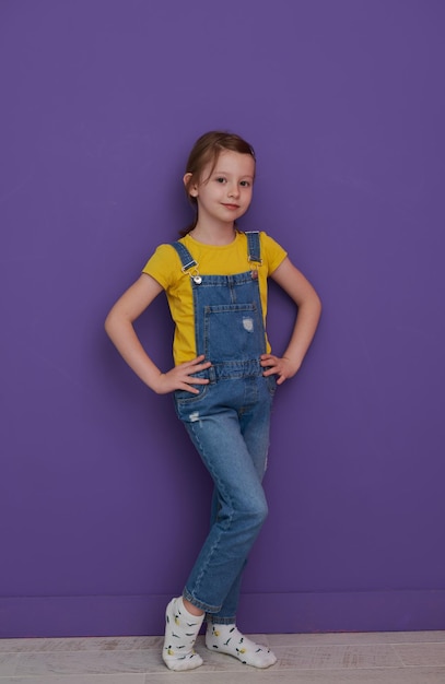 cute children portrait. Little girl smiling at home making funny face and acting