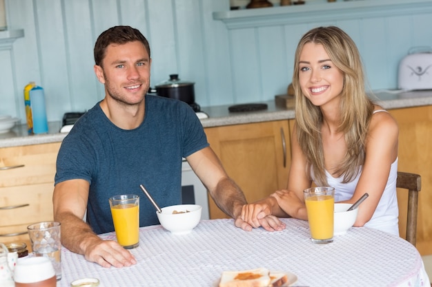 Cute couple having breakfast together