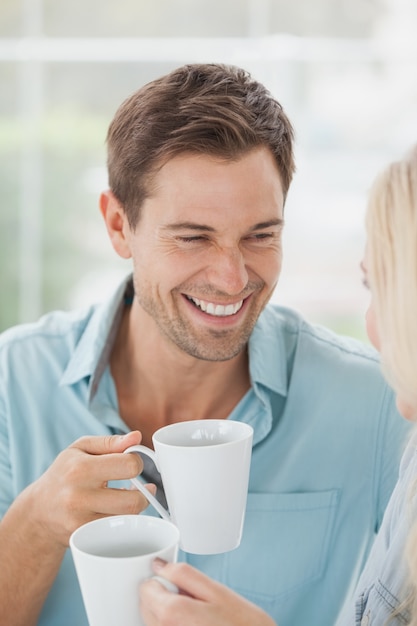 Cute couple having coffee together in cafe