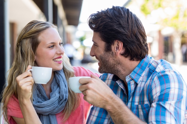 Cute couple having coffee together